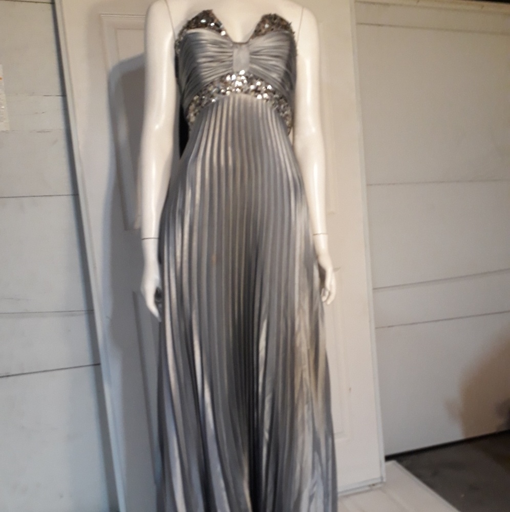 A pleated silver dress, label "cinderella"
